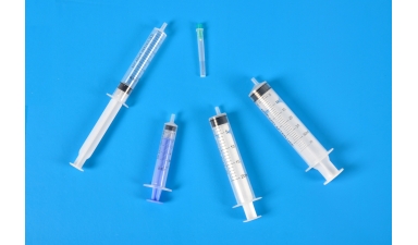 Sterile low frictional force syringes for single use